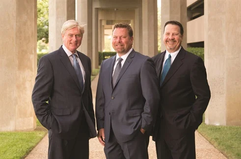 Flanking Dent Zone founder and Nobilis Group President and CEO Troy Good are (left) Jeff Snowden, senior director of agent development for the AutoBodyGuard brand and Nobilis COO Stan Starnes.