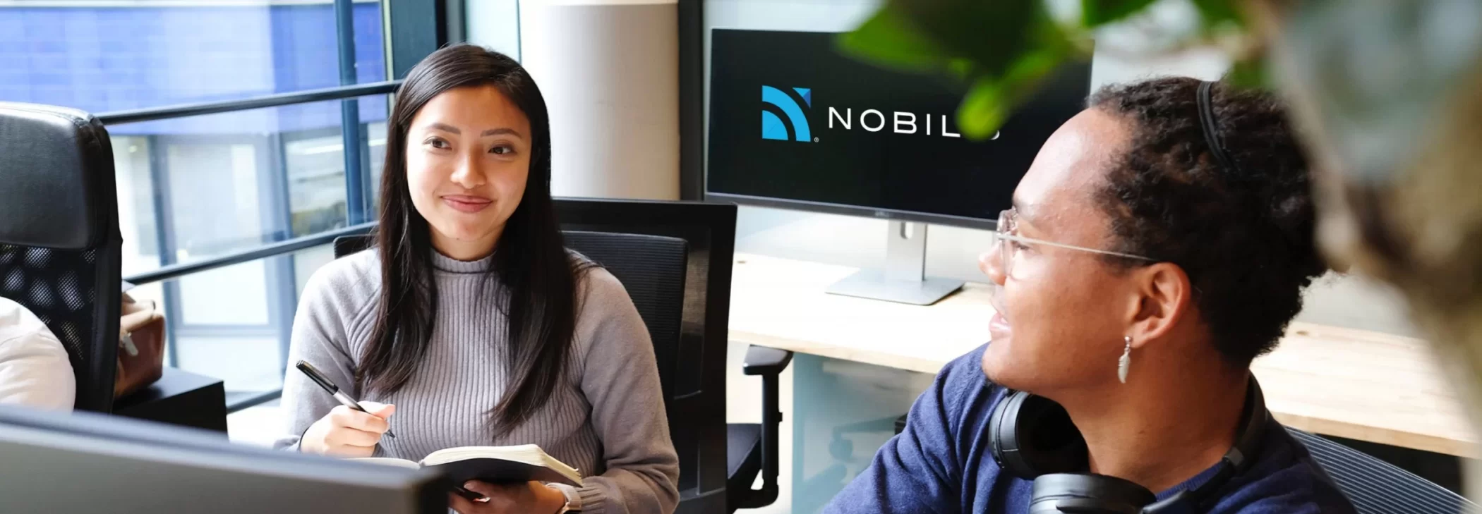 A diverse staff working at Nobilis